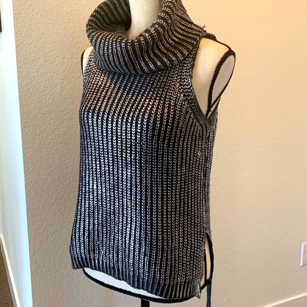 Sleeveless, cowl neck high low sweater